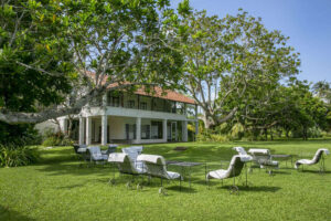 Boutique heritage hotel Club Villa Bentota featuring Geoffrey Bawa's tropical modernism architecture and lush garden landscape