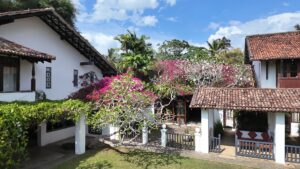 Boutique heritage hotel Club Villa Bentota featuring Geoffrey Bawa's tropical modernism architecture and lush garden landscape